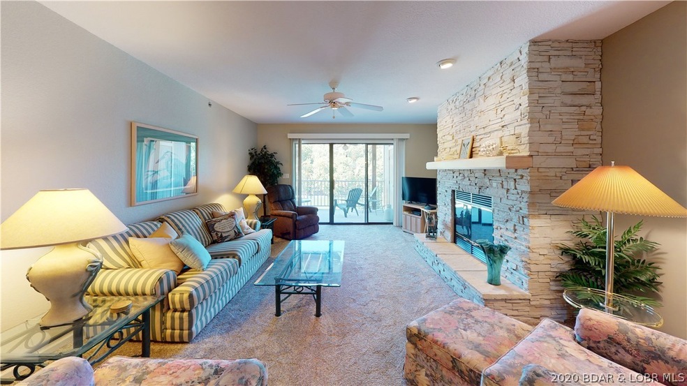 Main level living room with wood burning firepalce