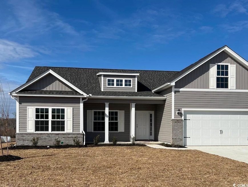 Craftsman-style home with a front yard