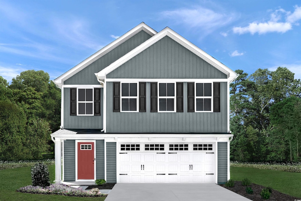 View of front of house featuring an attached garage, concrete driveway, and a front lawn
