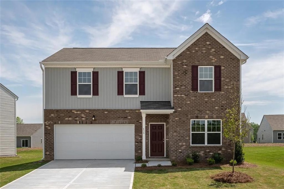 View of front of property with a garage and a fron