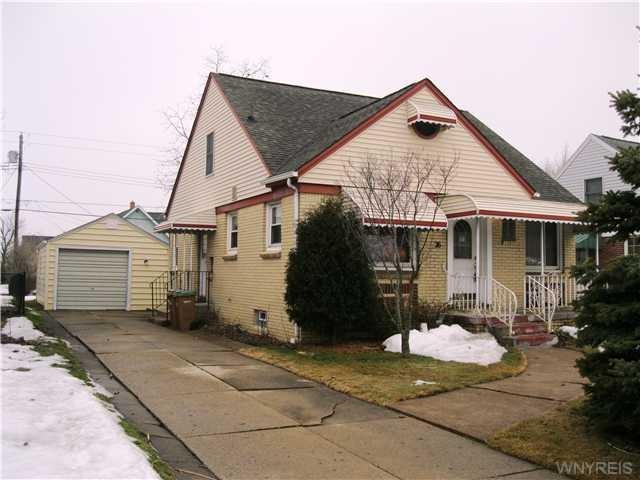 Exterior Front. Maintenance free cape with garage.