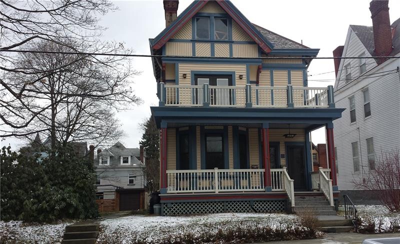 Front view and side yard on the left.