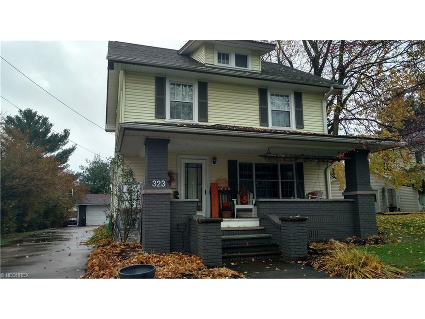 Inviting front porch.  Notice the paved driveway.