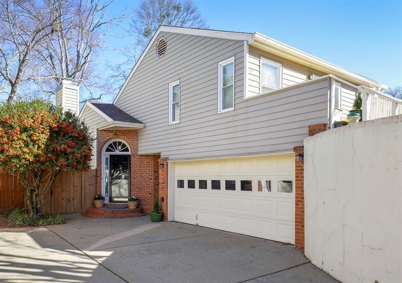 Townhome features a driveway AND a 2 car garage!