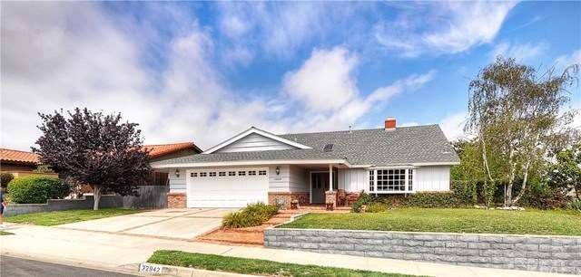 Newly painted exterior with large mature trees on 