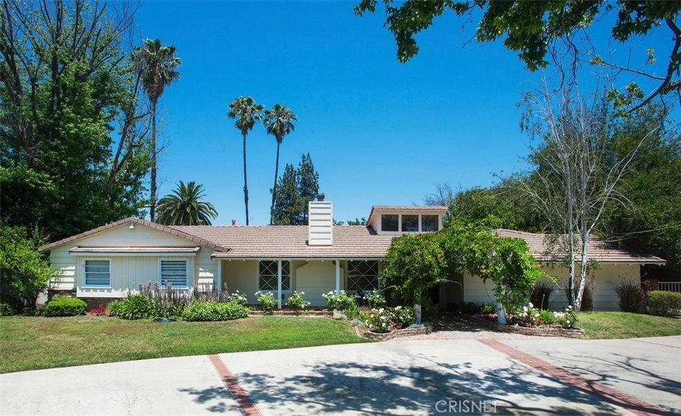 Front view with circular driveway