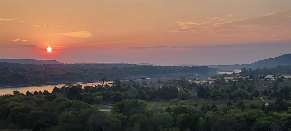 Property view of mountains featuring a water view