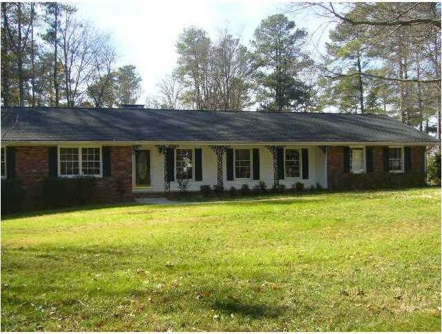 Exterior Front. Brick ranch on huge flat lot with 