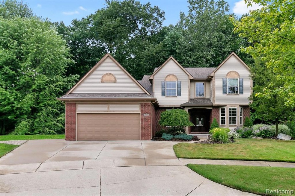 Extended driveway w/oversized 2 car garage & workshop. The sellers put in a French drain around the entire home, so no water in the basement, ever! There is a whole house generator hookup to the left also. Now come in & see all the updates/upgrades t