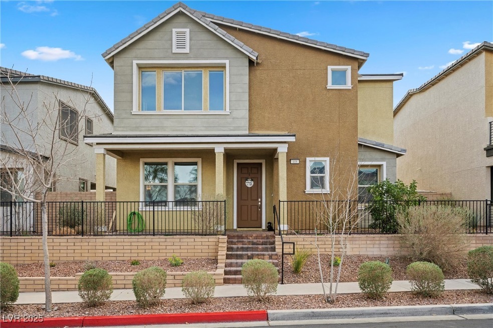 Traditional home with stucco siding, covered porch
