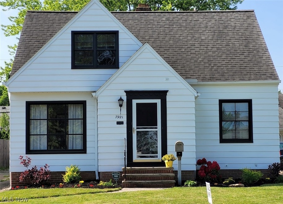 View of front of property with a front yard