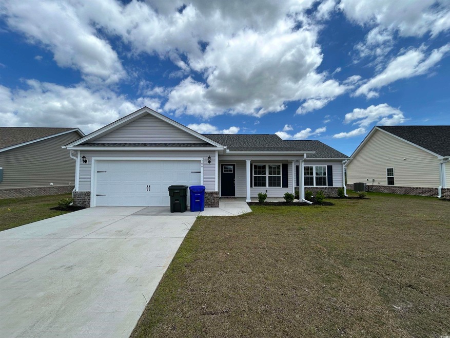 View of front of house with a garage and a front l