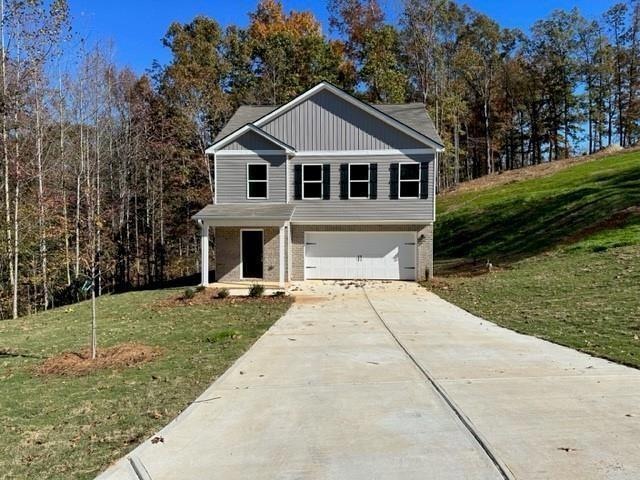 View of front of house featuring a front yard and 