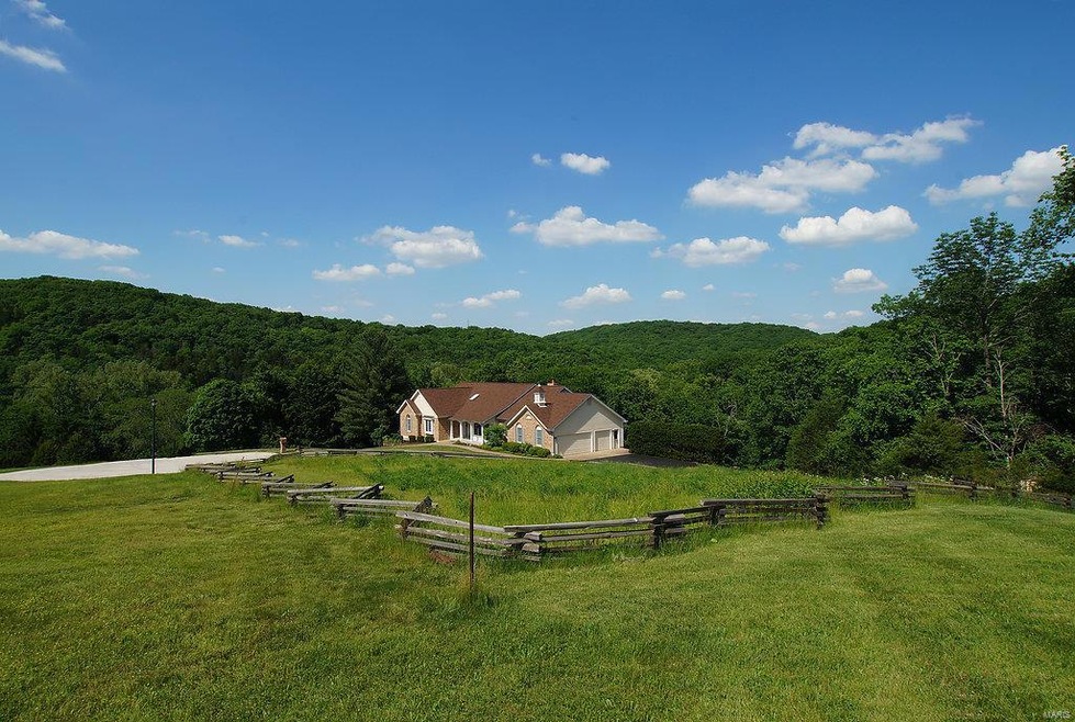 Split rail is property border- note the house is s