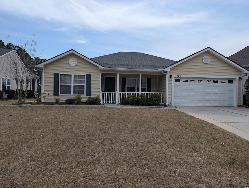 Single story home with a front yard, concrete driv
