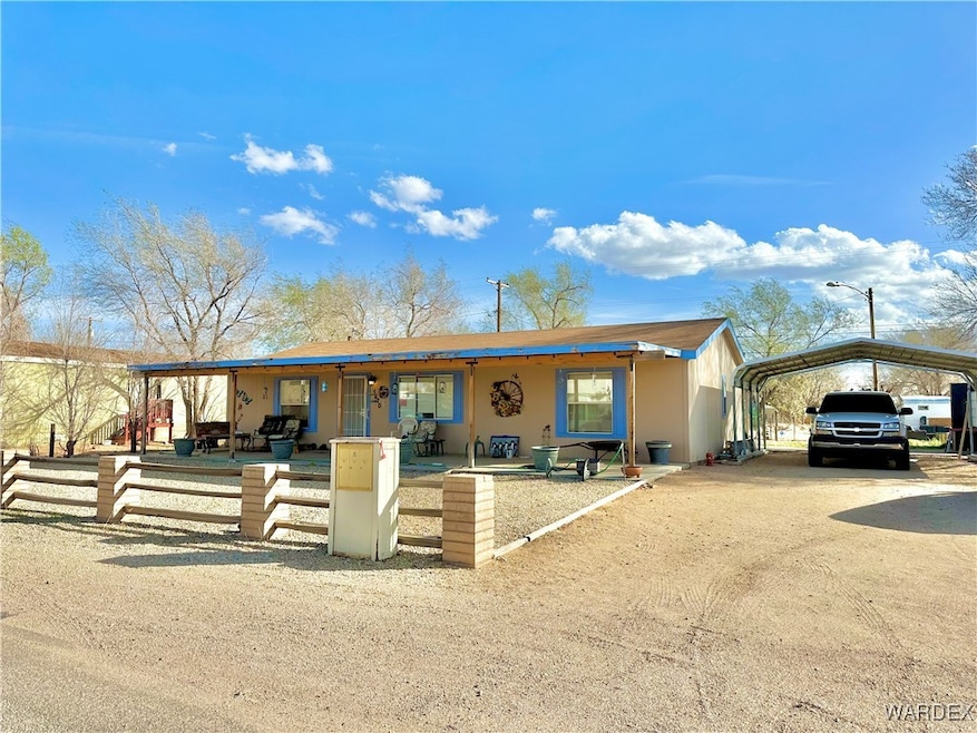 Full length covered patio and a covered carport.