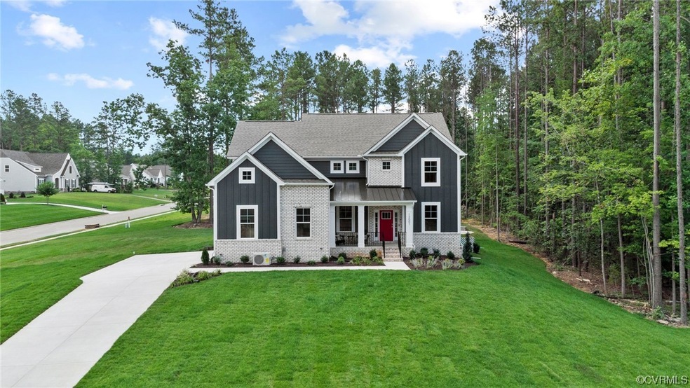 Craftsman-style home with a front yard