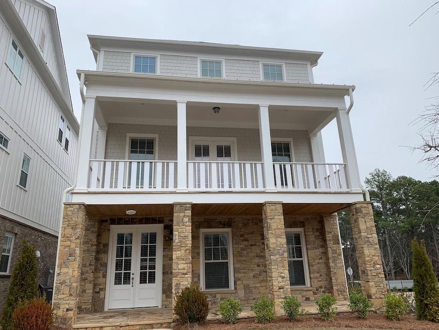 View of front of property featuring a balcony and 