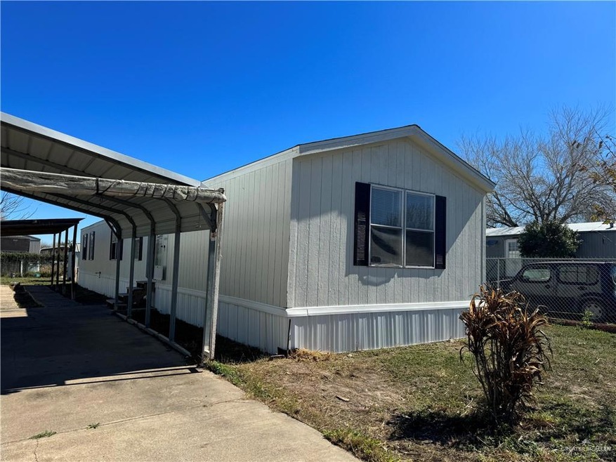 View of home's exterior with a carport
