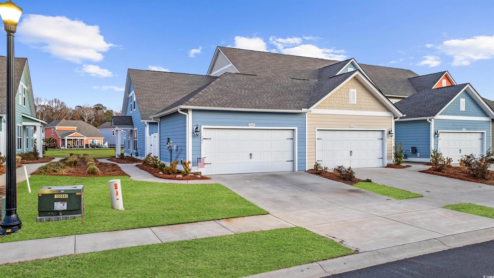 View of front of property with a garage and a fron
