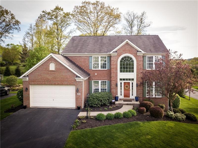 Brick Front 2 car attached garage with 2' front ex