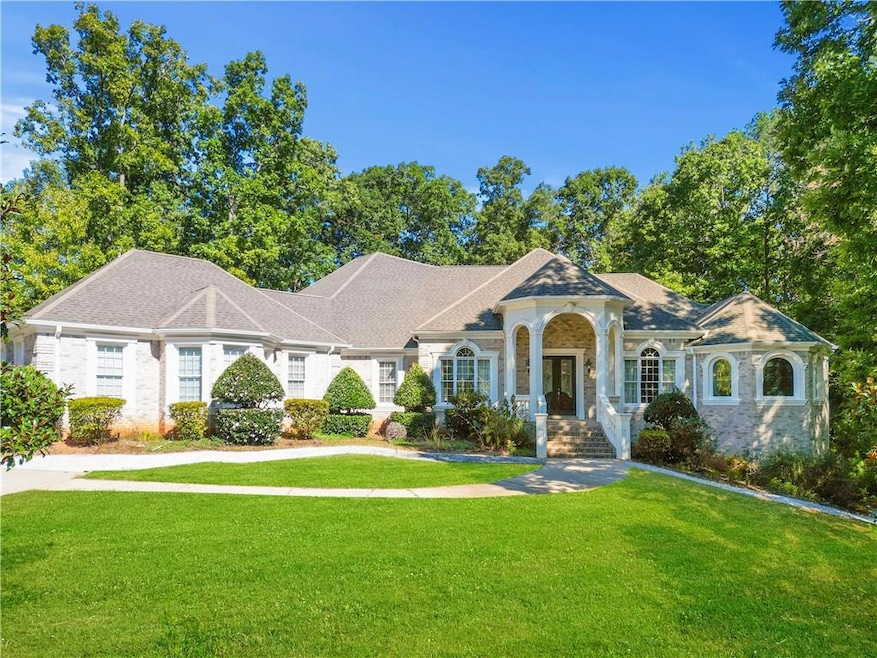 Single story home featuring a front lawn
