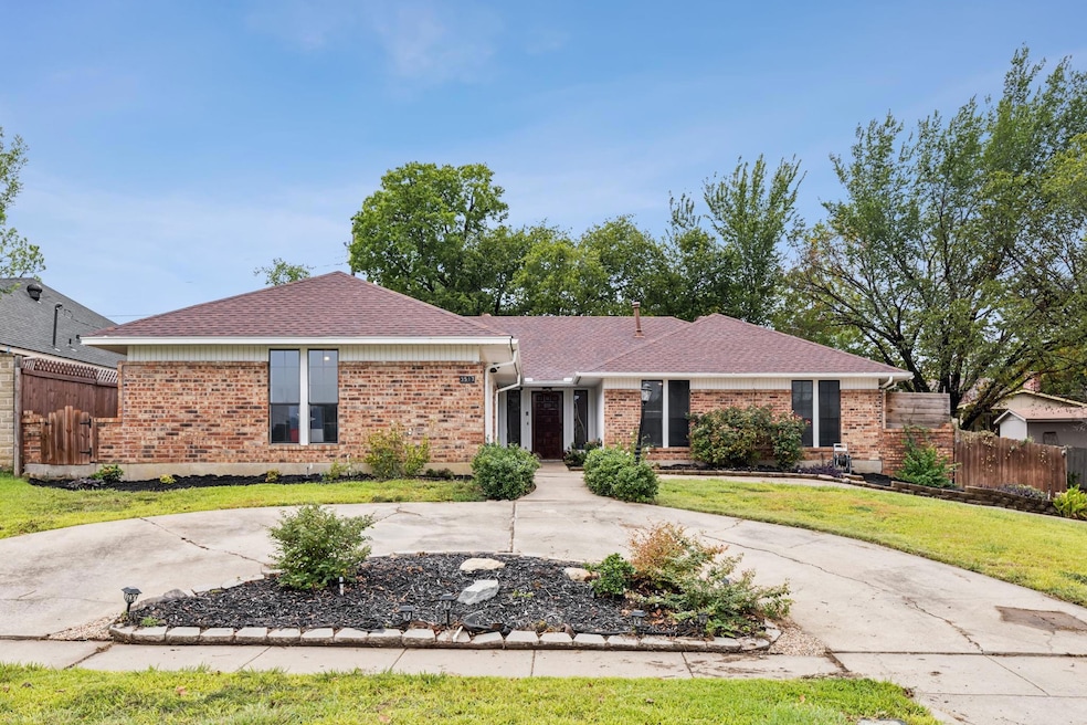 Ranch style home with circular drive.