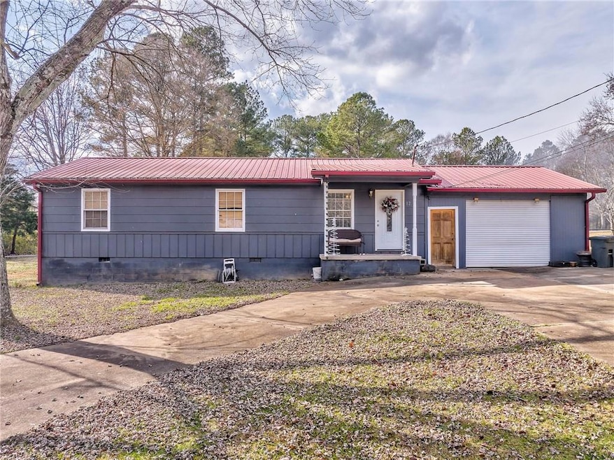 View of front of home featuring a garage