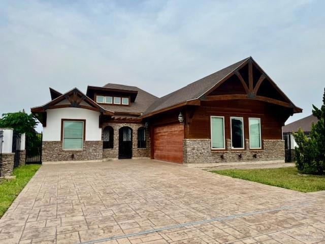 View of front of home featuring a garage