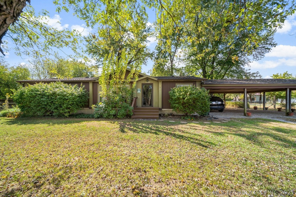 front of house with mature greenery