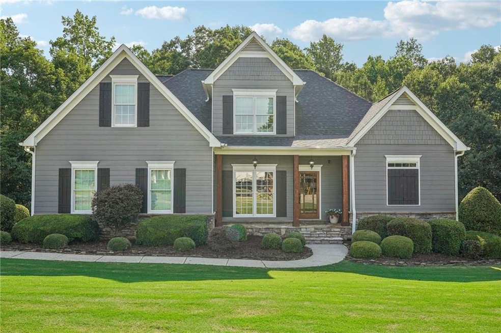 View of front of house featuring covered porch and