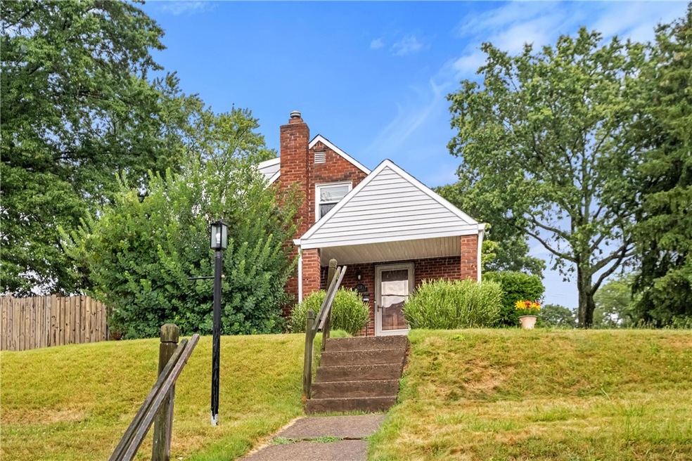Lovely cape cod perched on a corner lot.