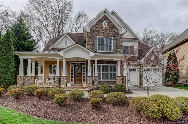 Custom stone and fiber cement home on amazing fenc