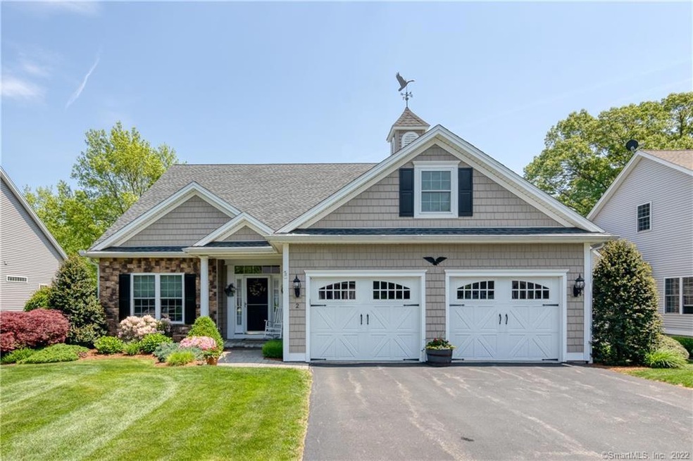 Additional construction details such as the cupola, stone facade and porch column add character to this home.