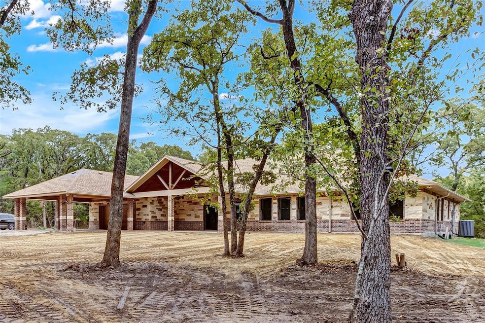 Gorgeous Custom home on 10.44+/- Wooded Acres.