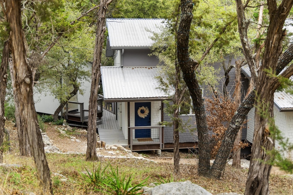 View of front of property featuring a deck and me