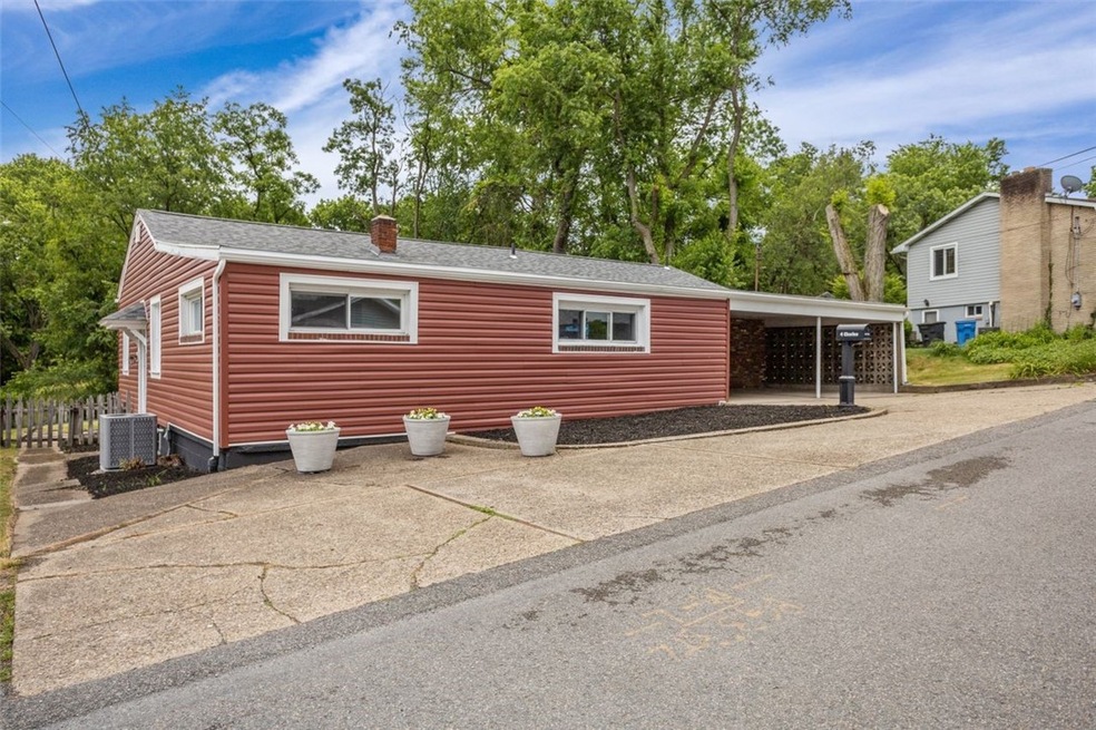 Welcome to 4 Charles Drive in Scott Township. The