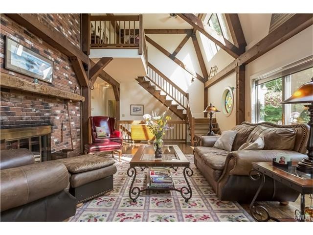 Enter this dramatic post and beam home with 20