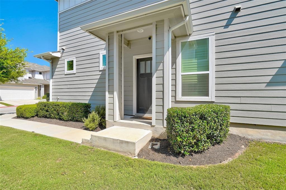 Entrance to property featuring a lawn