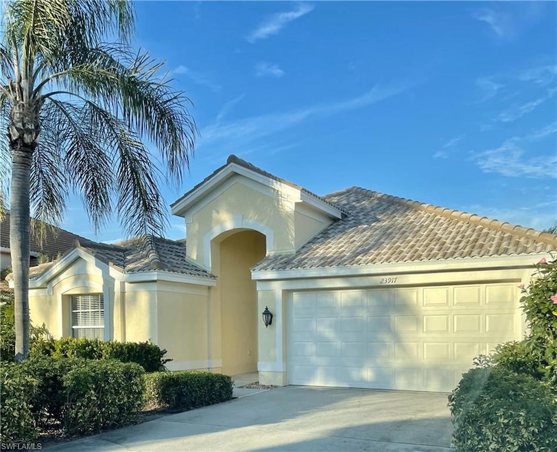 Front view-2 car garage: Welcoming neighbors in Whisper Creek