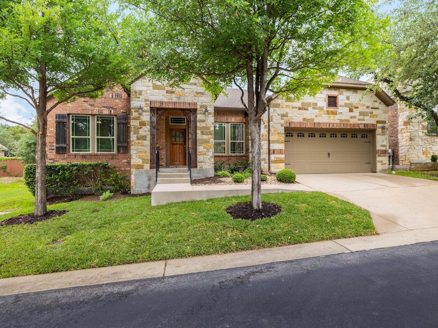 View of front of property featuring a garage, con