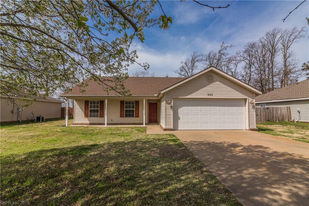 Welcome home to 665 Gamble Road in Centerton, AR.