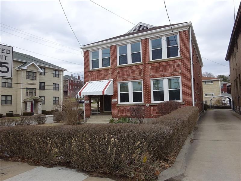 Solid brick up/down duplex in prime location