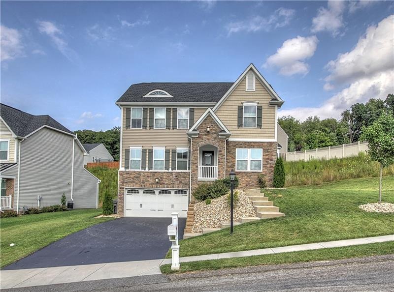 Curb Appeal Plus! This stone front features carria