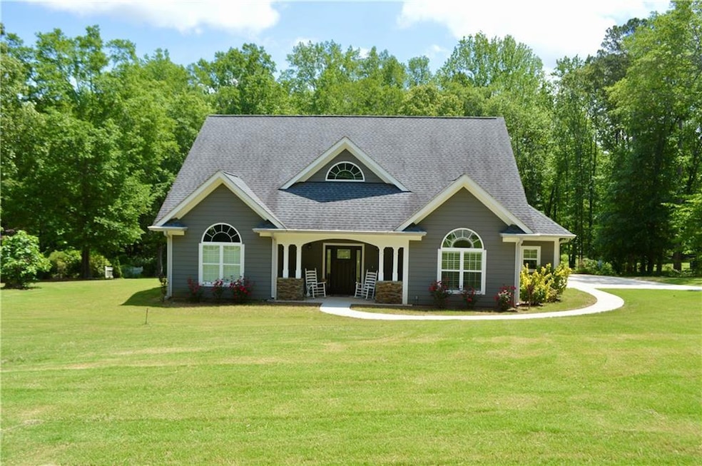 Craftsman inspired home featuring roof with shingl