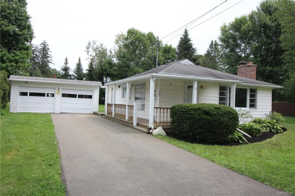 Pretty ranch home with wrap-around porch, 2 car ga