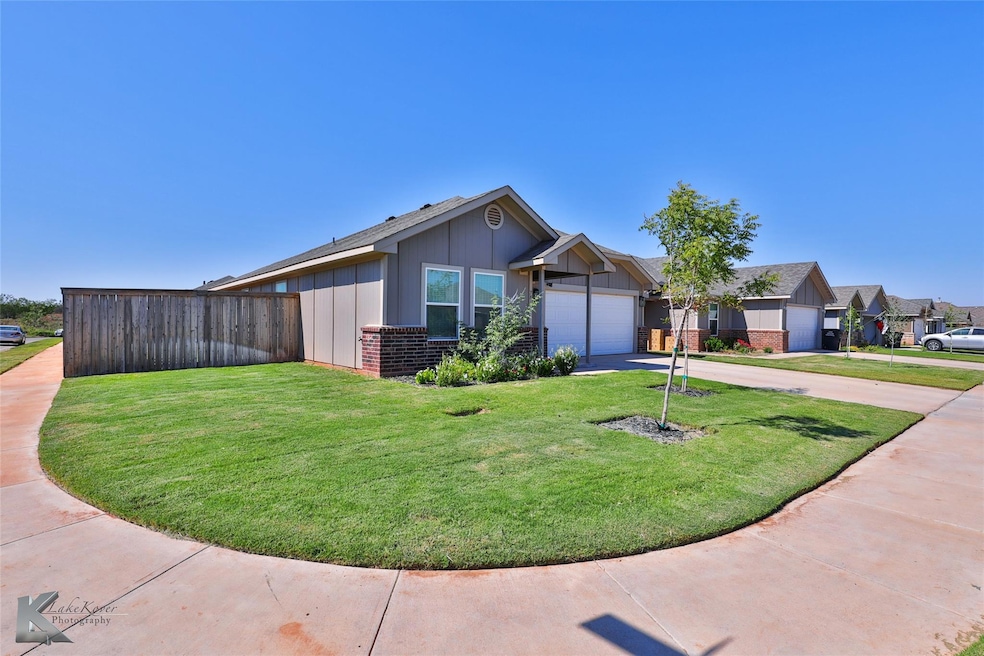 View of front of property with a front yard and a 