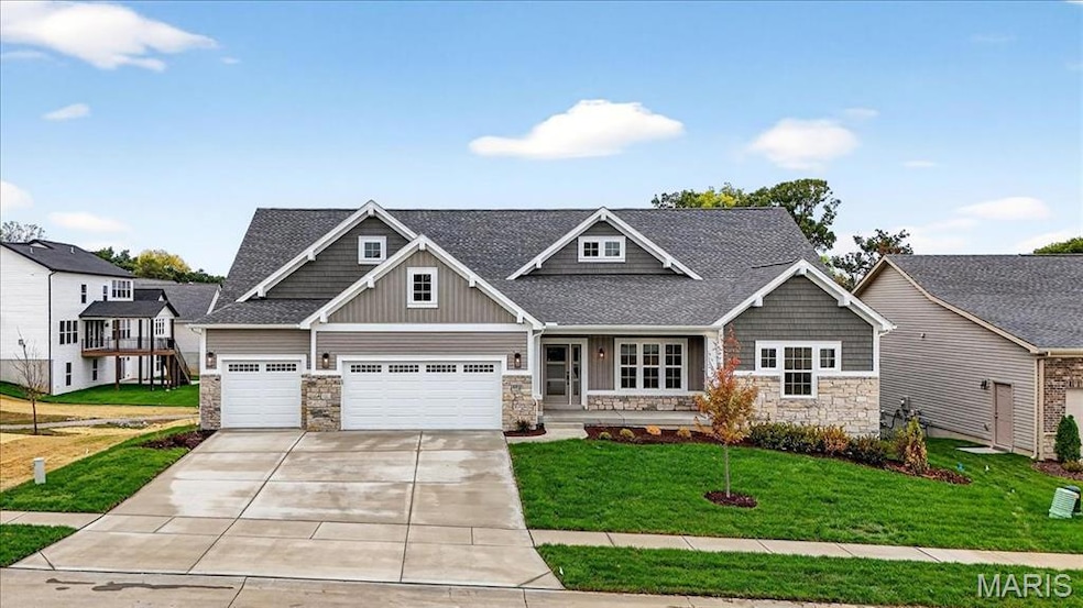 Craftsman inspired home with stone siding, covered porch, roof with shingles, and a front yard