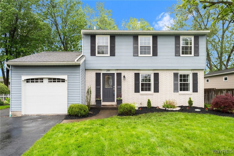 Brick front/vinyl siding (located on the slower en