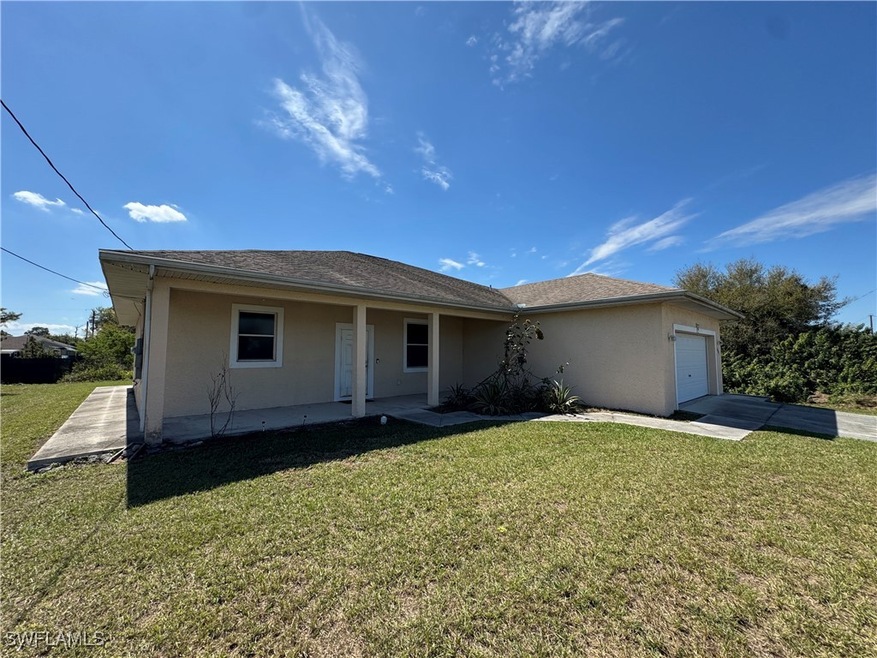 View of front of home featuring a garage, driveway